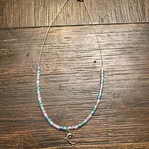 Handmade coral necklace with dolphin charm